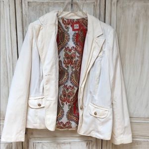 White blazer with golden accents